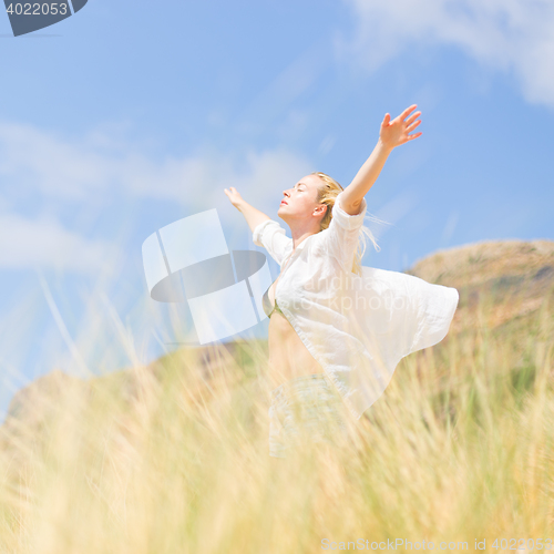 Image of Free Happy Woman Enjoying Sun on Vacations.