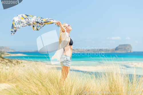 Image of Free Happy Woman Enjoying Sun on Vacations.