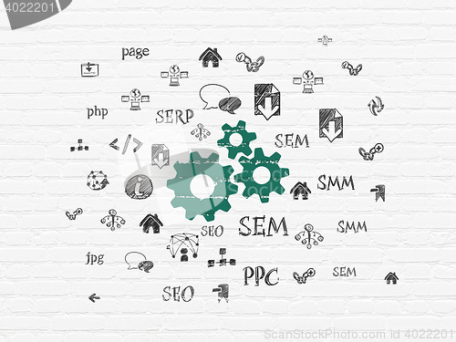 Image of Web development concept: Gears on wall background