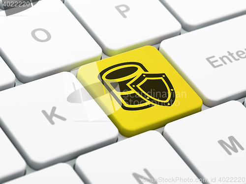 Image of Database concept: Database With Shield on computer keyboard background