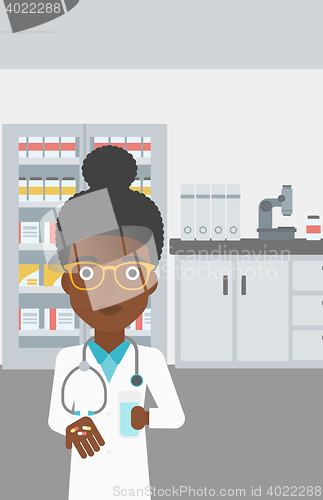 Image of Pharmacist giving pills and glass of water.