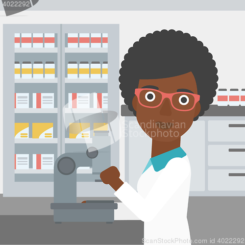 Image of Laboratory assistant with microscope.