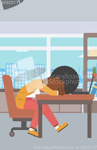 Image of Woman sleeping on workplace.