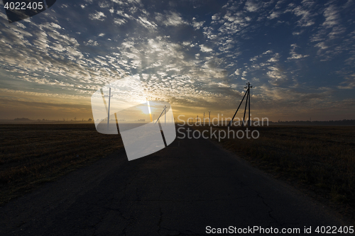 Image of power poles in the field