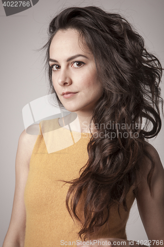 Image of stylish young woman posing in clear background