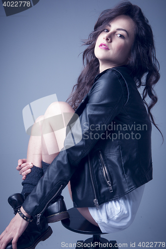 Image of stylish young woman posing in clear background