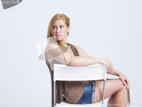 Image of stylish young woman posing in clear background