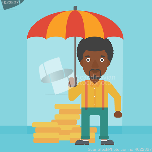 Image of Businessman with umbrella protecting money.