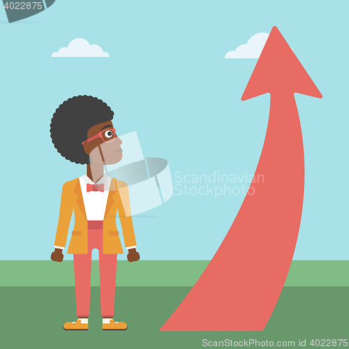 Image of Business woman looking at arrow going up.