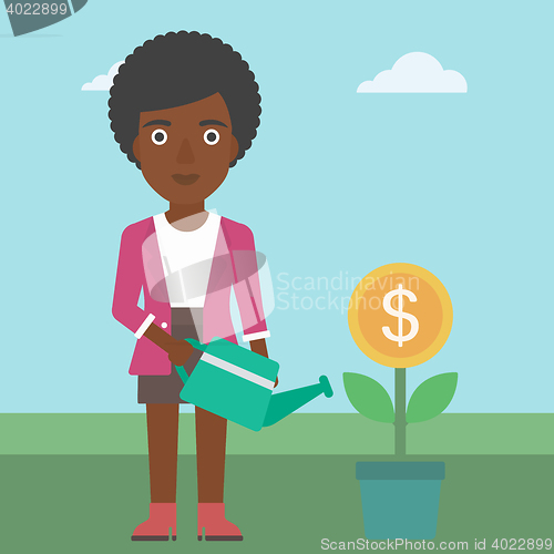 Image of Business woman watering money flower.