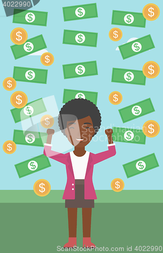 Image of Happy businessman under money rain.