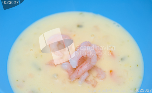 Image of Fish soup with shrimps in the blue bowl