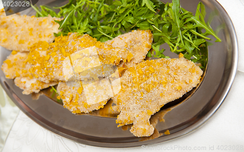 Image of Meat with corn breadcrumbs on the silver plate