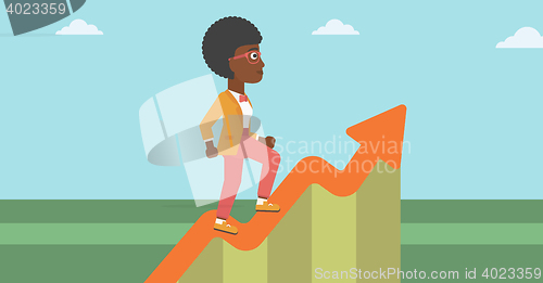 Image of Business woman running along the growth graph.