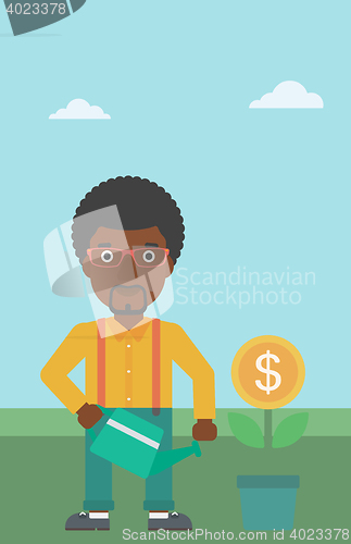 Image of Businessman watering money flower.