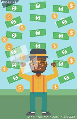 Image of Happy businessman under money rain.