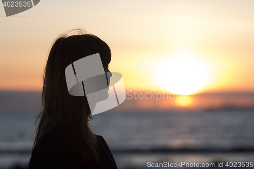 Image of Woman in Sunset