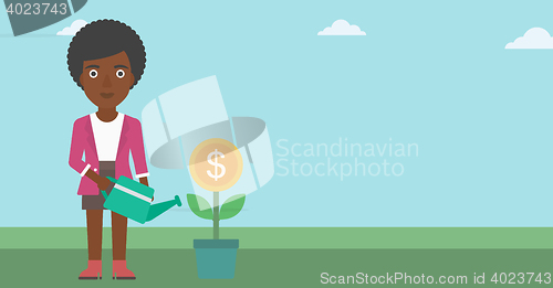 Image of Business woman watering money flower.