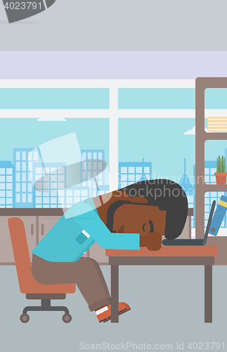 Image of Businessman sleeping on workplace.