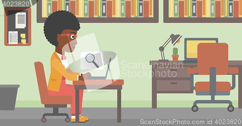 Image of Business woman working on her laptop.