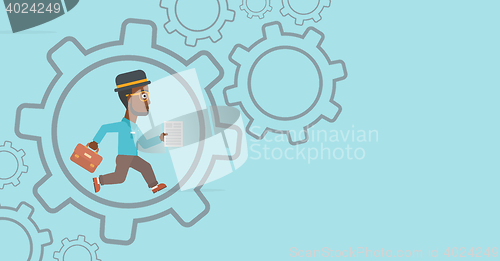 Image of Businessman running inside the gear.