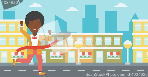 Image of Business woman crossing finish line.