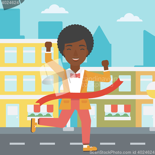 Image of Business woman crossing finish line.
