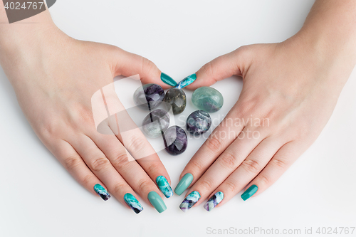 Image of Closeup of woman hands with colorful nails