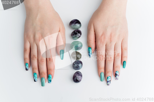 Image of Closeup of woman hands with colorful nails