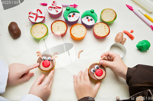 Image of Closeup of funny christmas cupcakes