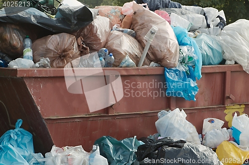 Image of Garbage Containers Full, Overflowing