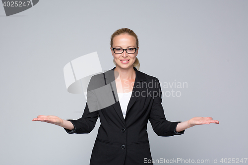 Image of Business woman showing hands sign to sides.