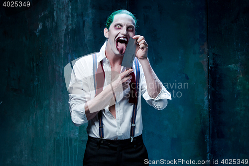 Image of Bloody Halloween theme: crazy joker face