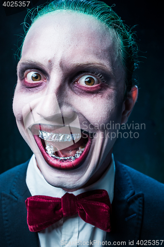 Image of Bloody Halloween theme: crazy joker face