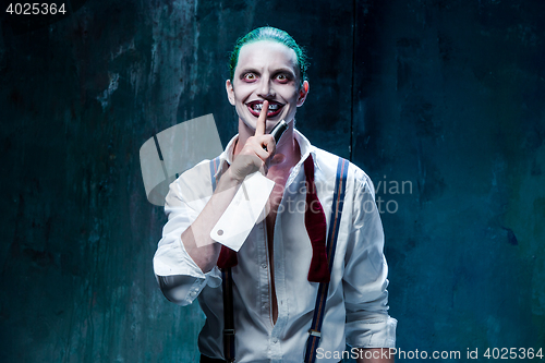 Image of Bloody Halloween theme: crazy joker face