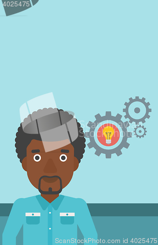 Image of Man with business idea bulb in gear.