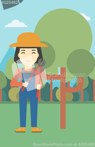 Image of Female farmer using pruner vector illustration.