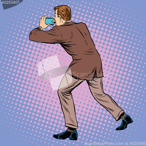 Image of Man back photographed on a smartphone