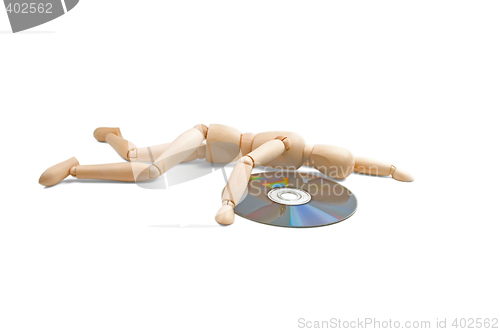 Image of wood mannequin with CD-rom