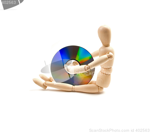 Image of wood mannequin with CD-rom