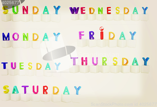 Image of Set of 3d colorful cubes with white letters - days of the week .