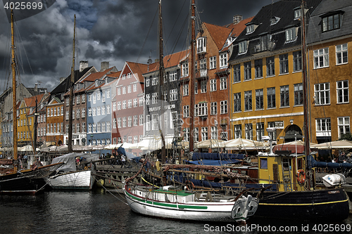 Image of COPENHAGEN, DENMARK - AUGUST 14, 2016: Boats in the docks Nyhavn