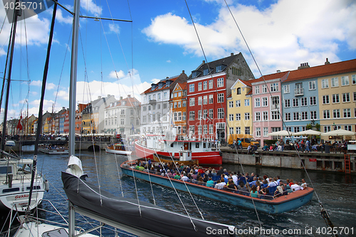Image of COPENHAGEN, DENMARK - AUGUST 15, 2016: Boats in the docks Nyhavn