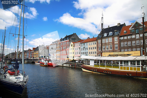 Image of COPENHAGEN, DENMARK - AUGUST 15, 2016: Boats in the docks Nyhavn