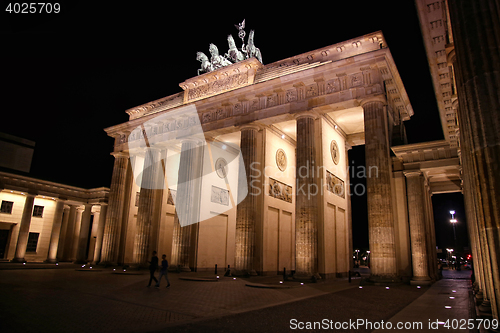 Image of Brandenburg gate at night in Berlin, Germany