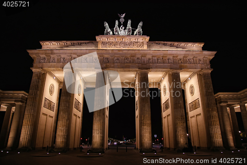 Image of Brandenburg gate at night in Berlin, Germany