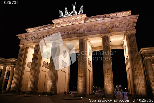 Image of Brandenburg gate at night in Berlin, Germany