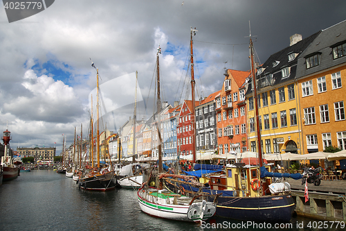 Image of COPENHAGEN, DENMARK - AUGUST 14, 2016: Boats in the docks Nyhavn