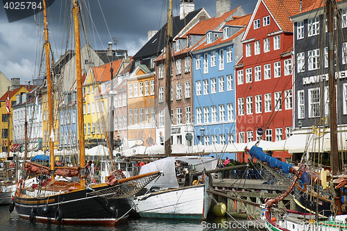 Image of COPENHAGEN, DENMARK - AUGUST 14, 2016: Boats in the docks Nyhavn