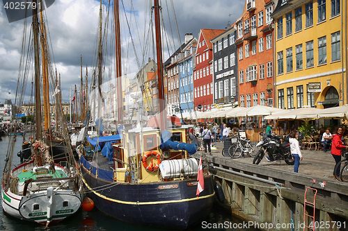 Image of COPENHAGEN, DENMARK - AUGUST 14, 2016: Boats in the docks Nyhavn